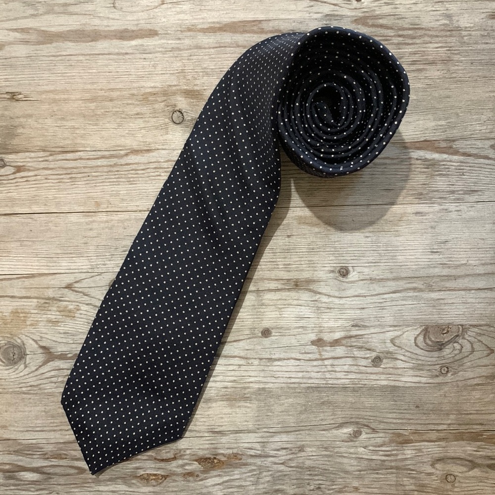 Hardy Amies tie.  Dark navy (almost black) with white polka dots.